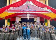 Didampingi Istri, Kasatpol PP Arizon Hadiri dan Ikuti Upacara HUT Kampar ke 75